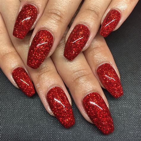 red nails with glitter design